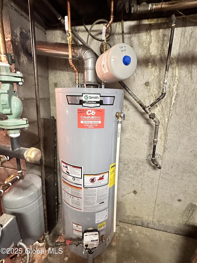 utility room featuring water heater