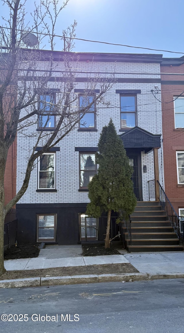 view of front of home featuring brick siding