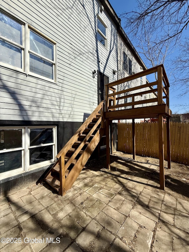 exterior space featuring stairs and fence