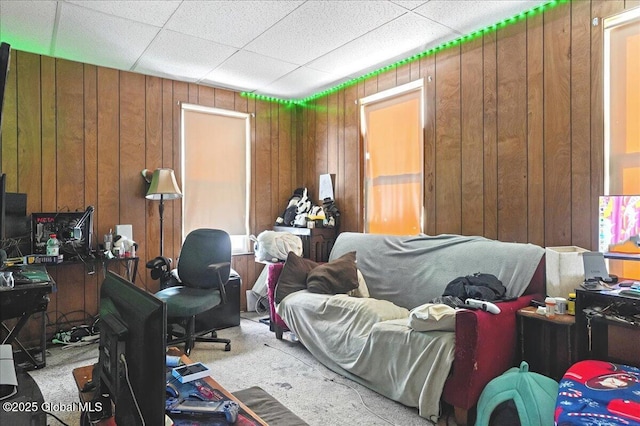 carpeted bedroom with wooden walls