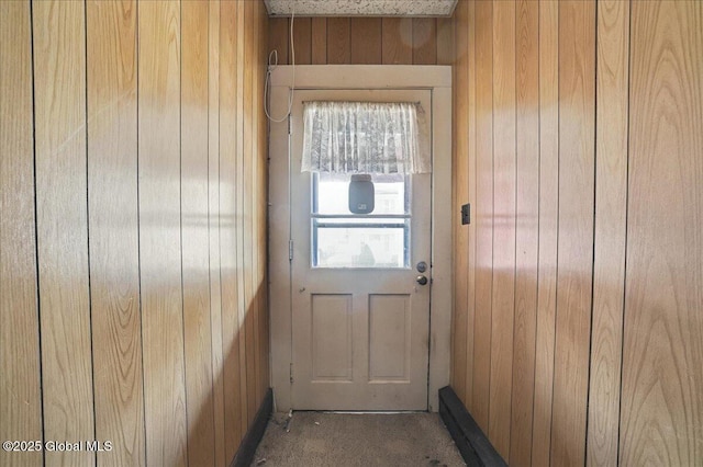 doorway with wooden walls