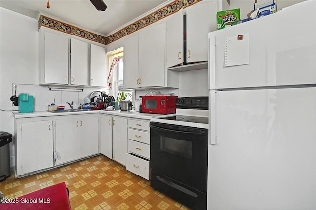 kitchen with white appliances, light floors, a sink, light countertops, and white cabinets