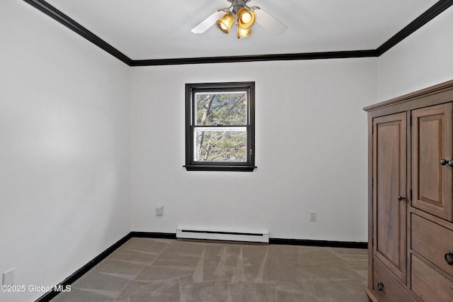 carpeted spare room with crown molding, baseboards, baseboard heating, and ceiling fan