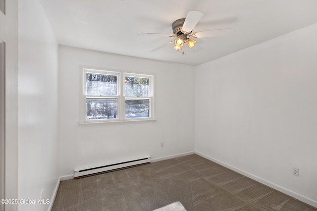 unfurnished room with baseboard heating, dark carpet, a ceiling fan, and baseboards