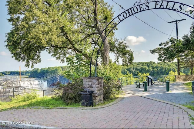 view of property's community featuring fence