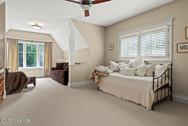 bedroom featuring vaulted ceiling, a ceiling fan, baseboards, and carpet floors