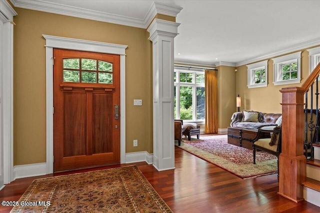 entrance foyer featuring decorative columns, baseboards, dark wood-style floors, and crown molding