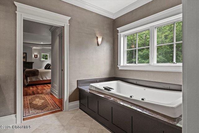 ensuite bathroom with a garden tub, baseboards, tile patterned flooring, crown molding, and connected bathroom