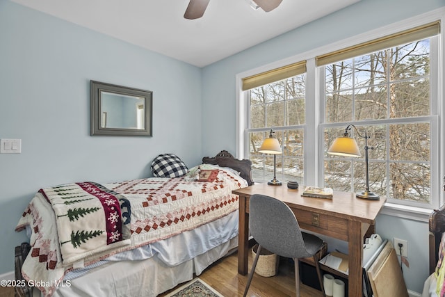 bedroom with wood finished floors and ceiling fan