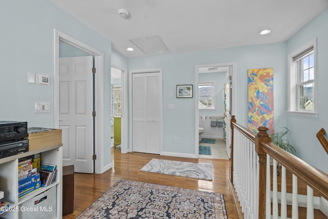 foyer entrance featuring recessed lighting, baseboards, and wood finished floors