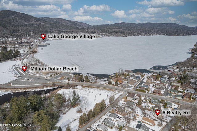 aerial view featuring a mountain view and a residential view