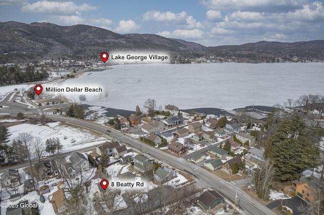 aerial view featuring a mountain view and a residential view