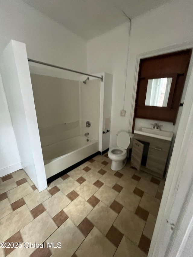 bathroom featuring vanity, toilet, and shower / washtub combination