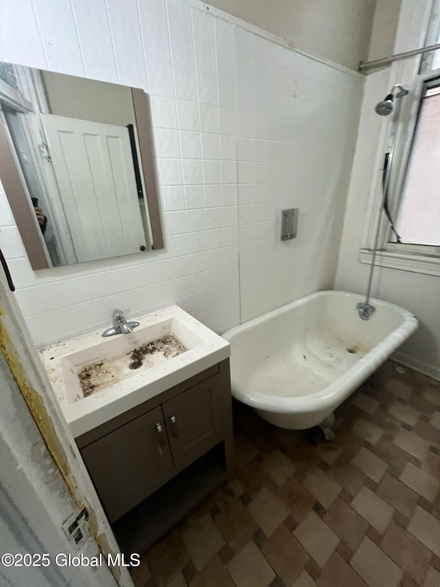 bathroom featuring vanity, a shower, tile walls, a bathtub, and tasteful backsplash