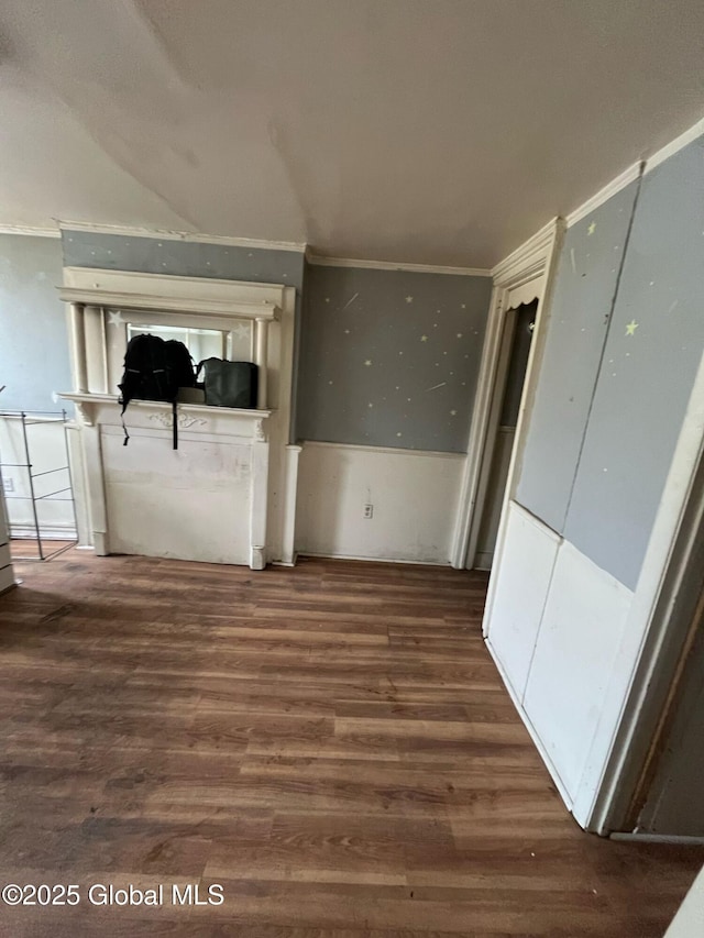 interior space with crown molding and wood finished floors