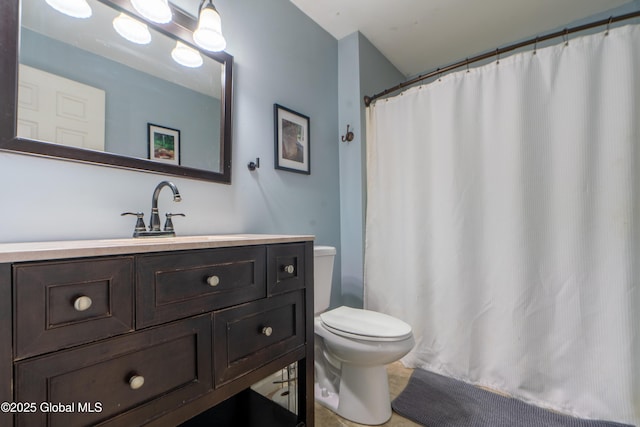 full bathroom featuring vanity, curtained shower, and toilet