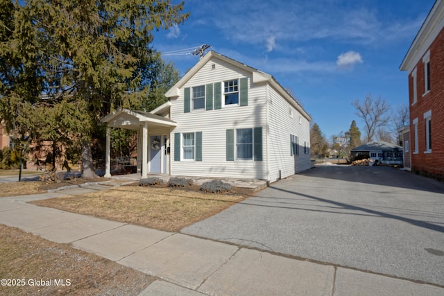 traditional home with aphalt driveway