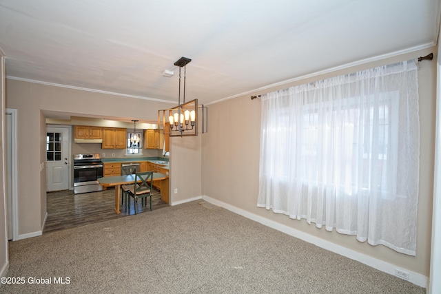 dining area featuring baseboards, crown molding, an inviting chandelier, and dark colored carpet