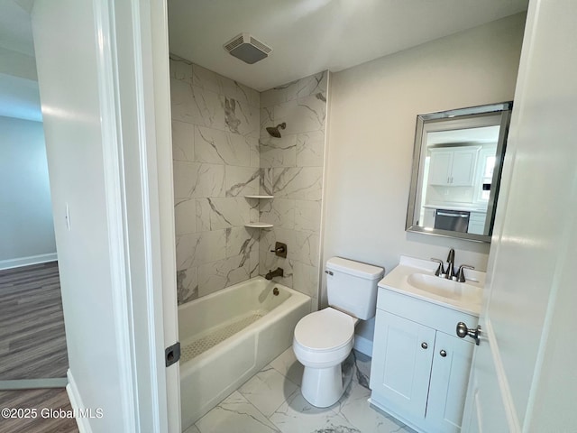 full bathroom featuring toilet, marble finish floor, shower / washtub combination, baseboards, and vanity