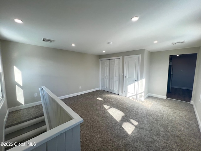 interior space featuring visible vents, recessed lighting, and baseboards