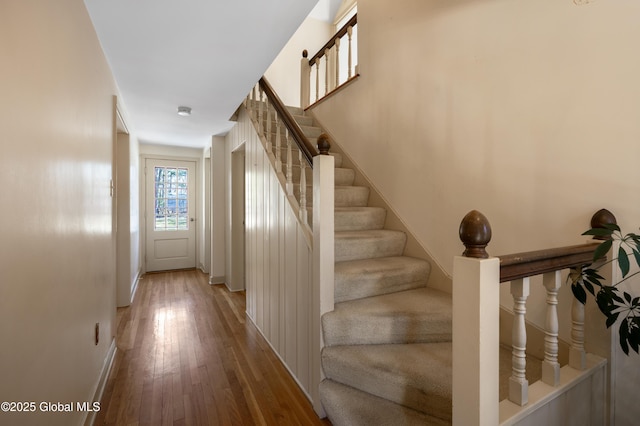 staircase with wood finished floors