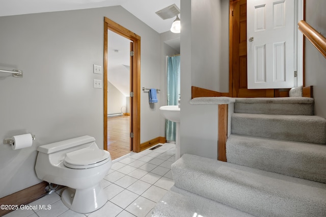 bathroom featuring tile patterned floors, visible vents, toilet, and vaulted ceiling