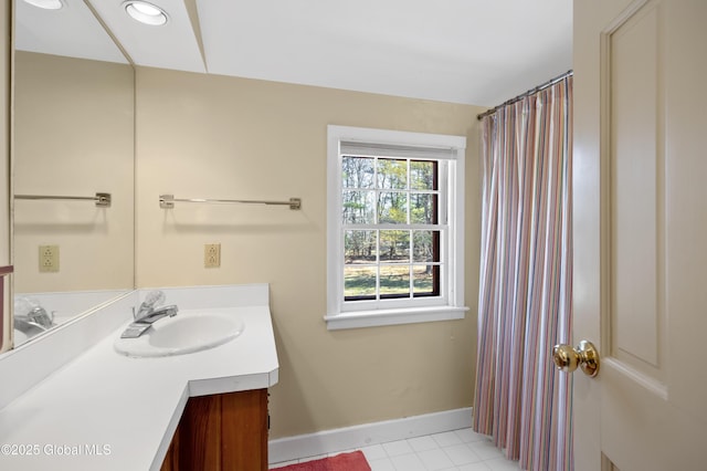 bathroom with tile patterned floors, baseboards, recessed lighting, and vanity