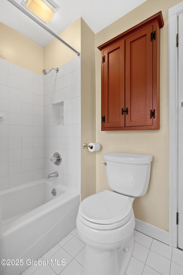 full bathroom with baseboards, toilet, washtub / shower combination, and tile patterned flooring