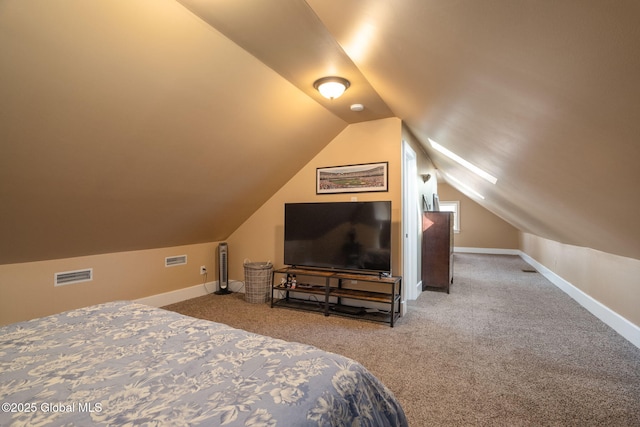 bedroom with visible vents, baseboards, lofted ceiling, and carpet flooring