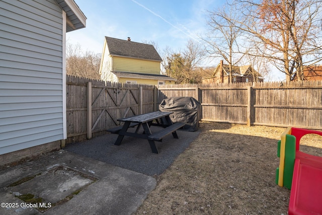 view of yard with a patio and a fenced backyard