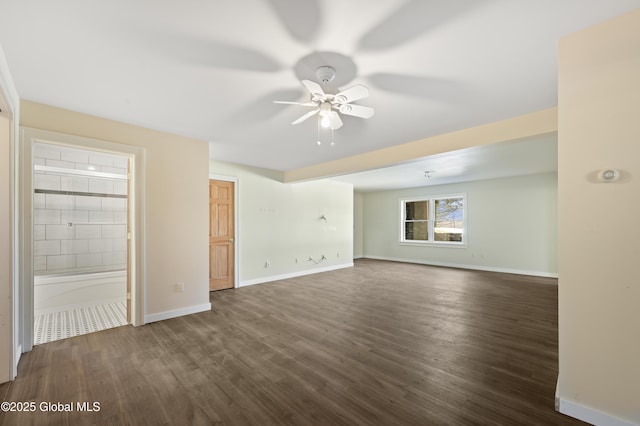 unfurnished living room featuring baseboards, wood finished floors, and ceiling fan