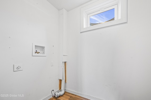 laundry room featuring hookup for a washing machine, wood finished floors, baseboards, hookup for an electric dryer, and laundry area