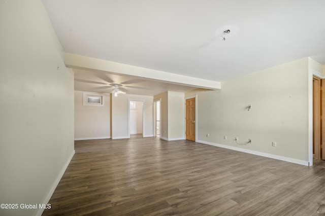 unfurnished room featuring ceiling fan, baseboards, and wood finished floors