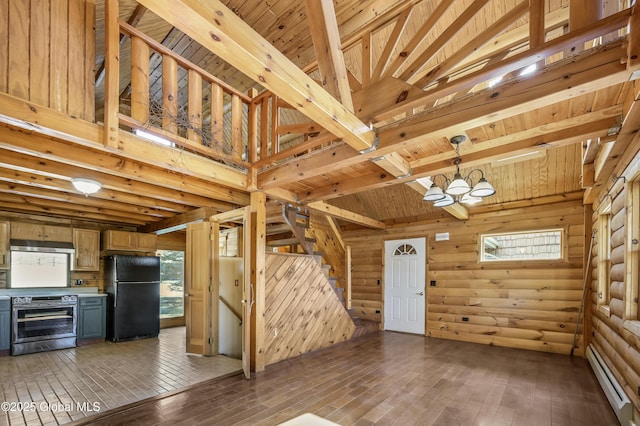 unfurnished living room with an inviting chandelier, wood ceiling, and baseboard heating