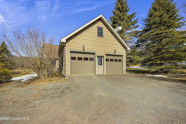 garage featuring driveway