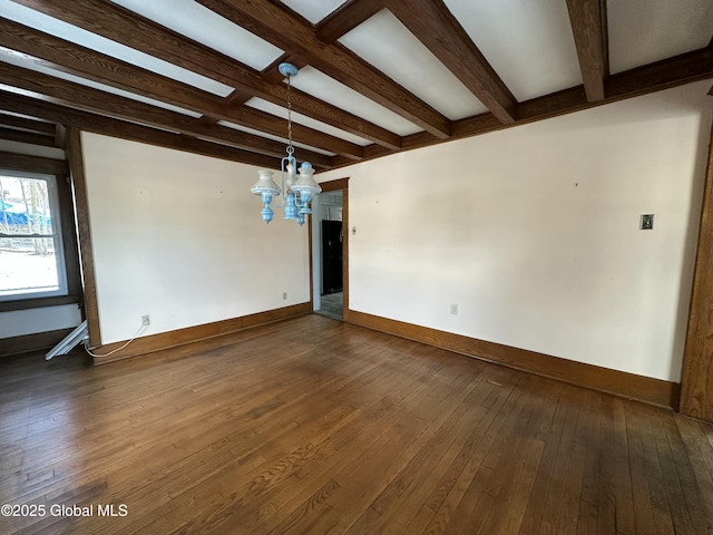 spare room with baseboards, a notable chandelier, beam ceiling, and dark wood finished floors