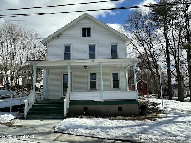 american foursquare style home featuring crawl space and a porch