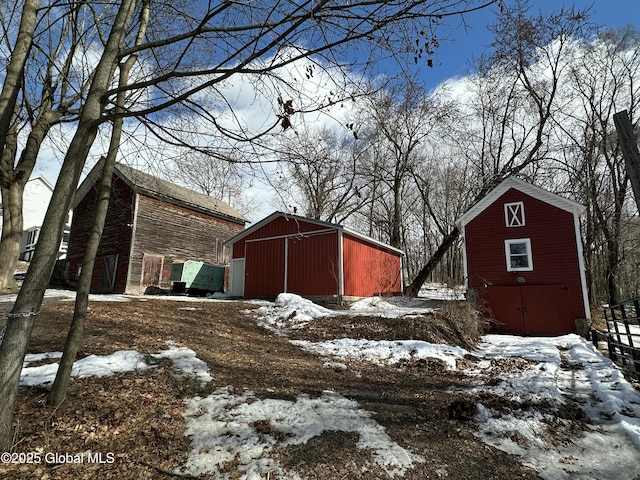 exterior space with an outbuilding, a garage, and an outdoor structure