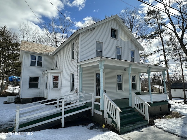 view of front of house featuring covered porch and central AC