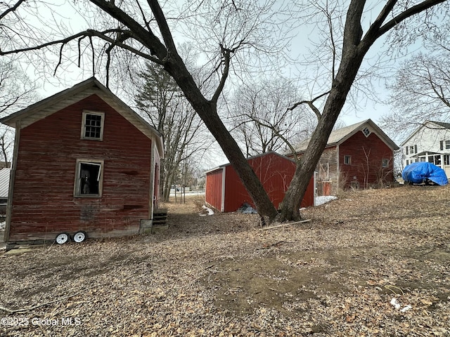 view of side of property featuring an outdoor structure