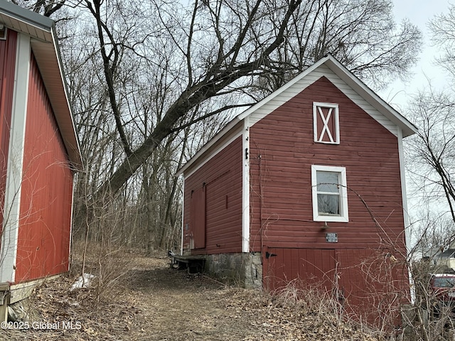 view of property exterior featuring an outdoor structure