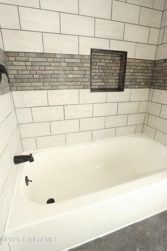 full bath featuring bathing tub / shower combination