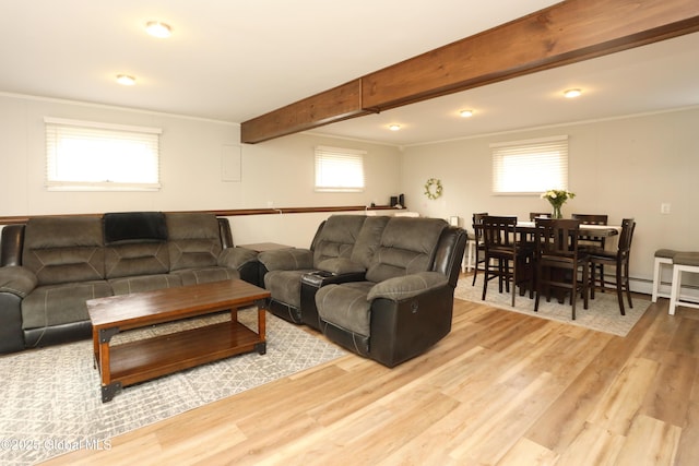 living room featuring beam ceiling, light wood-style flooring, and crown molding