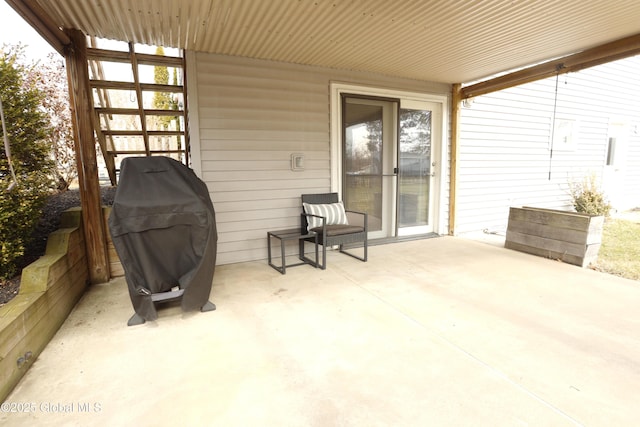 view of patio featuring a grill