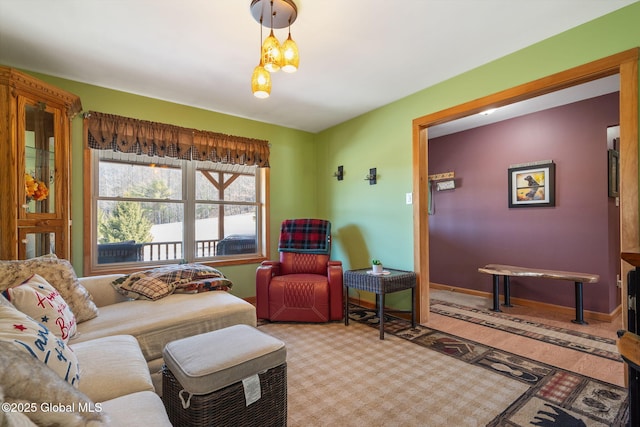 living area featuring baseboards