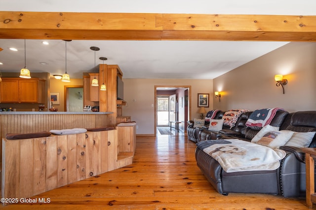 living room featuring beamed ceiling, recessed lighting, and light wood-style floors