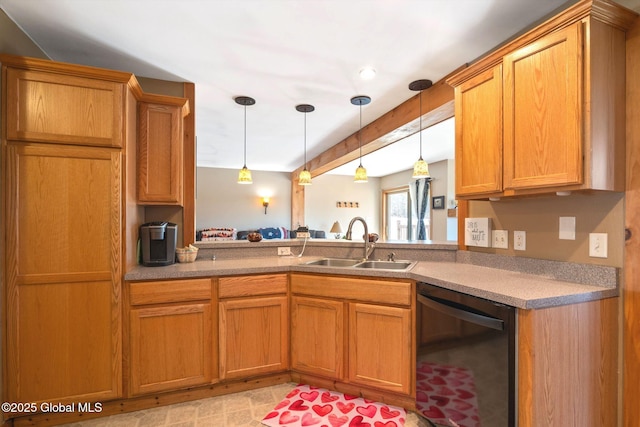 kitchen with a sink, dishwasher, brown cabinetry, and hanging light fixtures