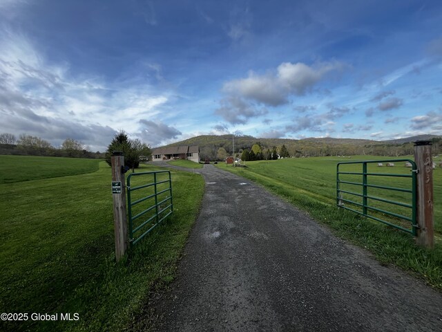 4953 Gun House Hill Rd, Kortright, NY 13842 - view of street featuring a rural view, a gated entry, a gate, and aphalt driveway