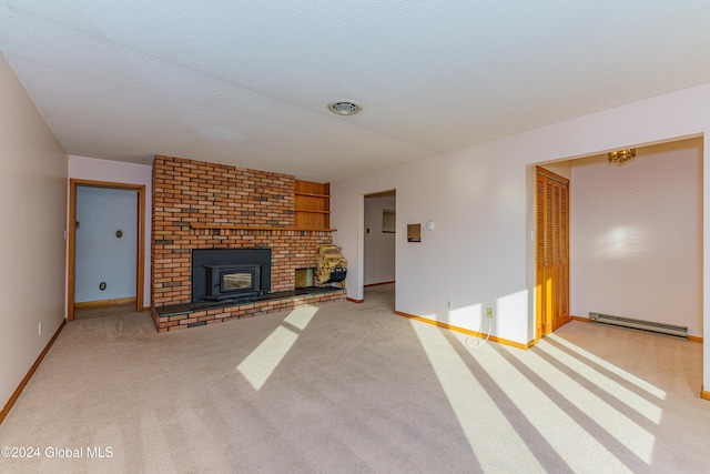 unfurnished living room featuring visible vents, a baseboard heating unit, baseboards, light colored carpet, and a textured ceiling