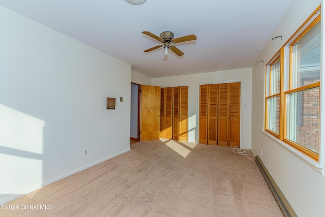 empty room featuring baseboards, carpet, and ceiling fan